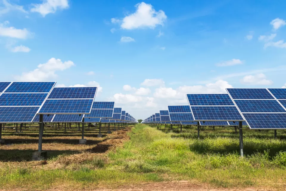 Solar panels in a green field